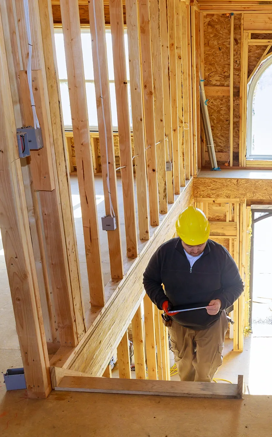Construction business owner reviewing payroll paperwork